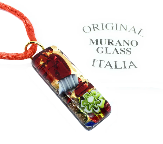 This Murano Passion Millefiori Pendant with Gold Leaf boasts a vibrant abstract design featuring red, gold, and green elements. It comes attached to a red cord and includes a Certificate of Authenticity, showcasing "Original Murano Glass Italia" in the background. The pendant measures 3cm by 1cm.