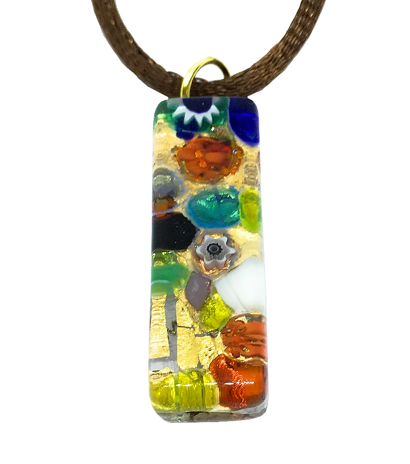 A vibrant Murano Passion pendant crafted with gold leaf showcases abstract designs in bold shades of blue, red, green, and yellow. It features floral and geometric shapes reminiscent of Millefiori pieces on a glossy surface and dangles from a brown cord.