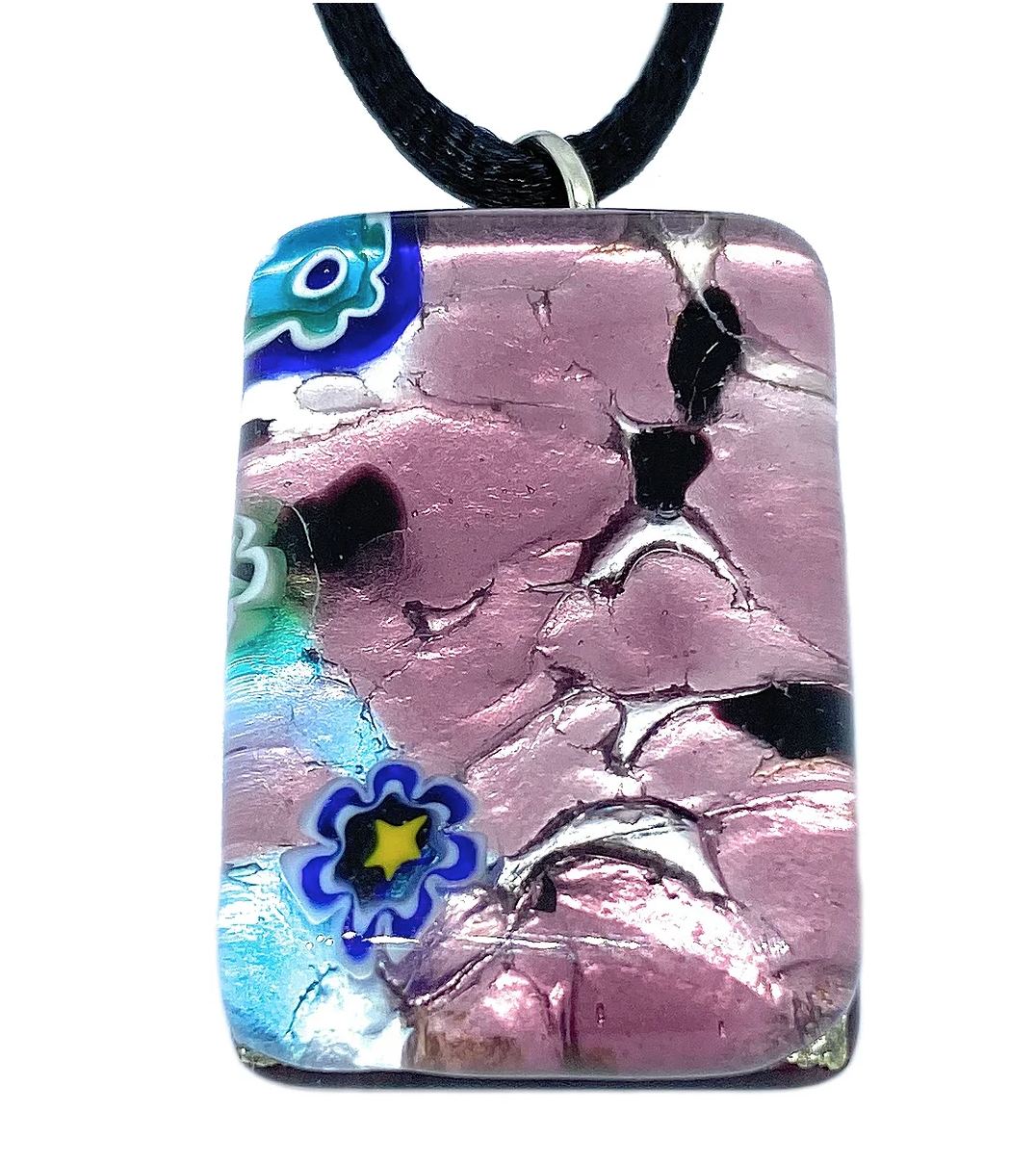 The Murano Passion pendant, named the Millefiori Pendant on Silver Leaf, measures 3cm by 2cm and features a cracked texture in metallic pink adorned with delicate blue and green floral designs. This exquisite piece of jewelry is made from Murano glass and elegantly hangs from a black cord. It comes with a Certificate of Authenticity.